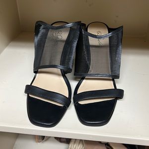 Black mules with mesh strap detail